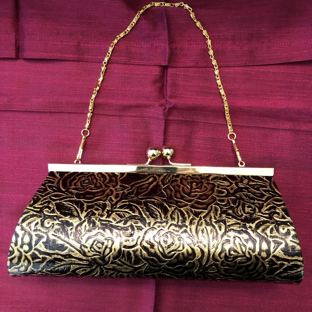 Elegant Gold and Black Clutch with Ornate Design
